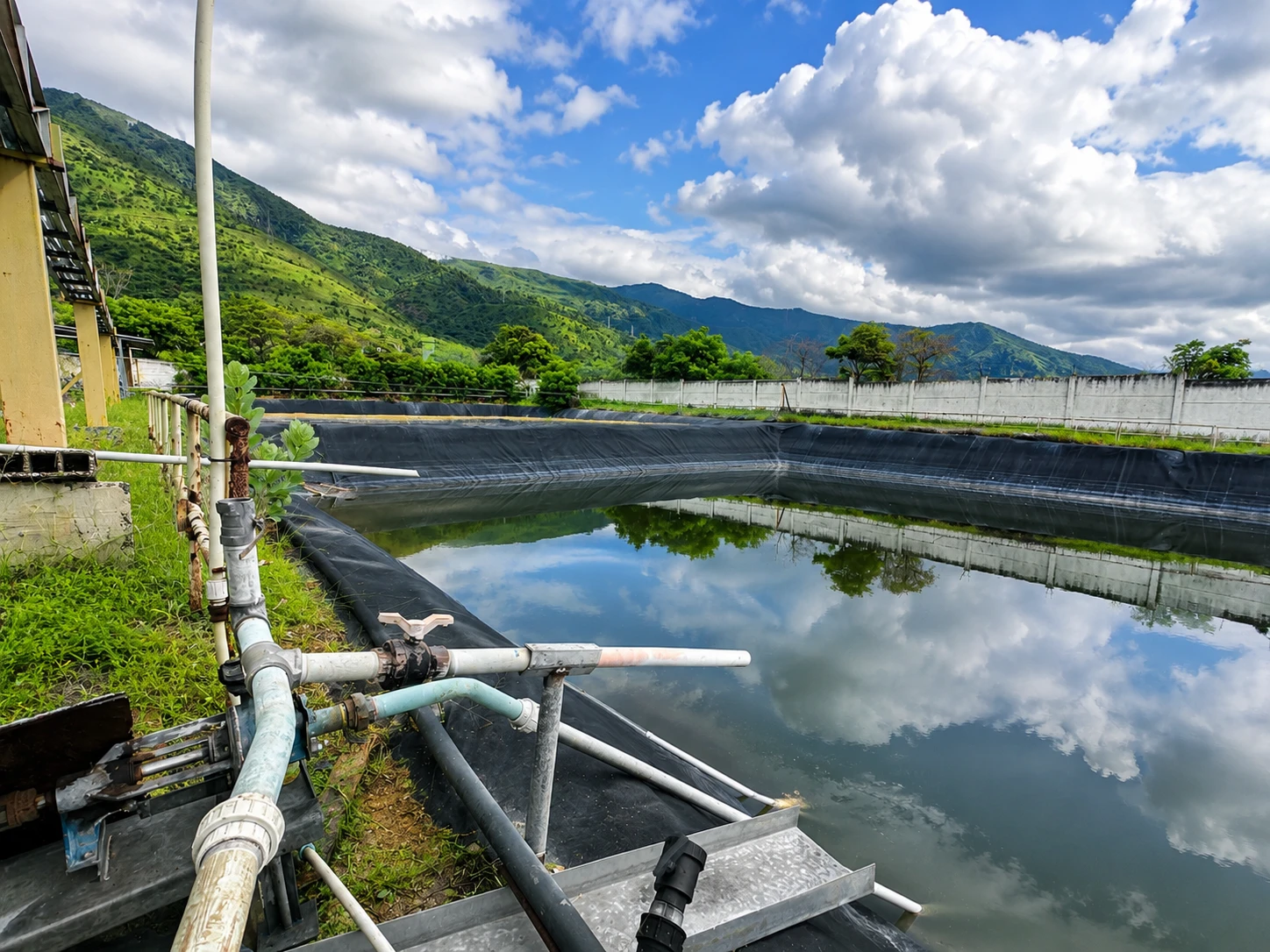 Lined water treatment pond and return piping at the FUNMETAL plant in Mariara